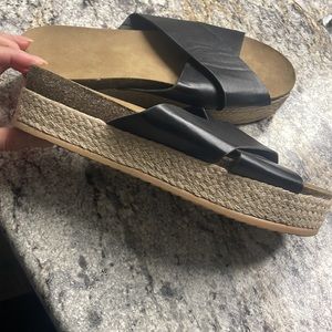Woman’s black and tan strappy sandals 42